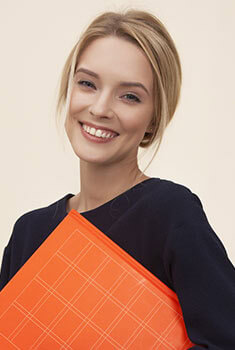 A woman holding an orange folder.
